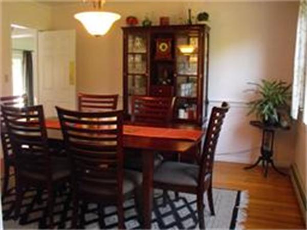 378 Burroughs Road Boxborough, MA 01719 - Photo 6 of 15 a view of a dining room with furniture and wooden floor