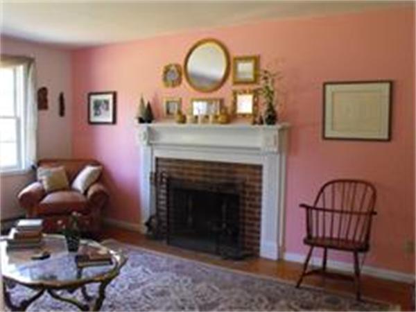 378 Burroughs Road Boxborough, MA 01719 - Photo 7 of 15 a living room with furniture a table and a fireplace