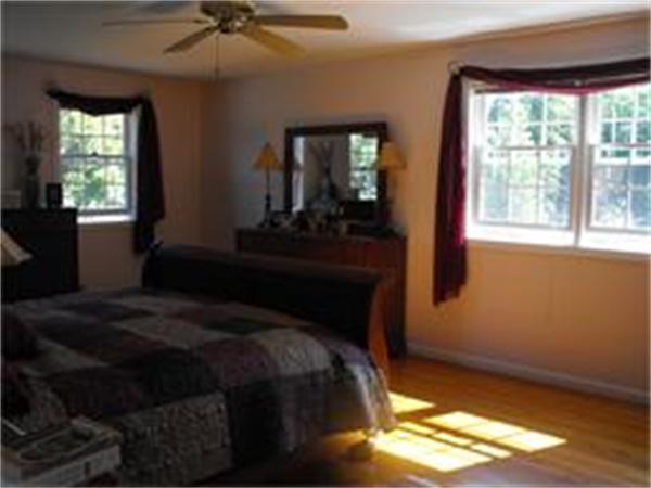 378 Burroughs Road Boxborough, MA 01719 - Photo 8 of 15 a bedroom with a bed and a window