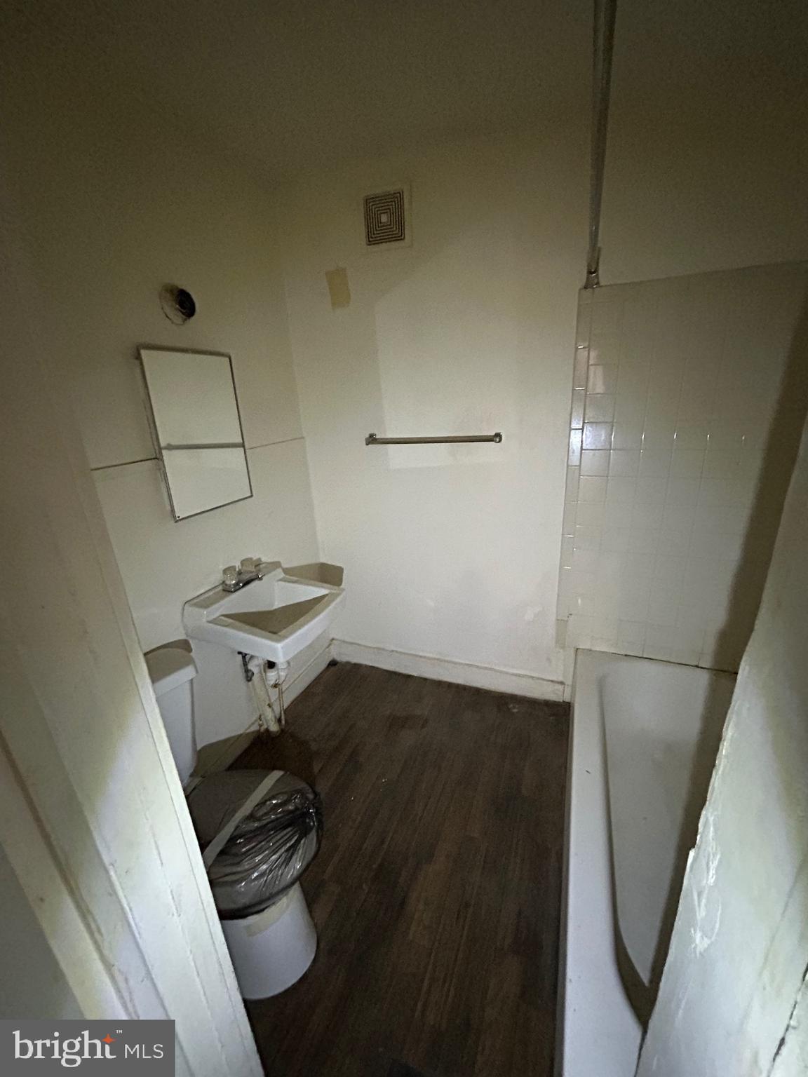 3206 Hayward Avenue Baltimore, MD 21215 - Photo 6 of 12 a bathroom with a sink and a toilet
