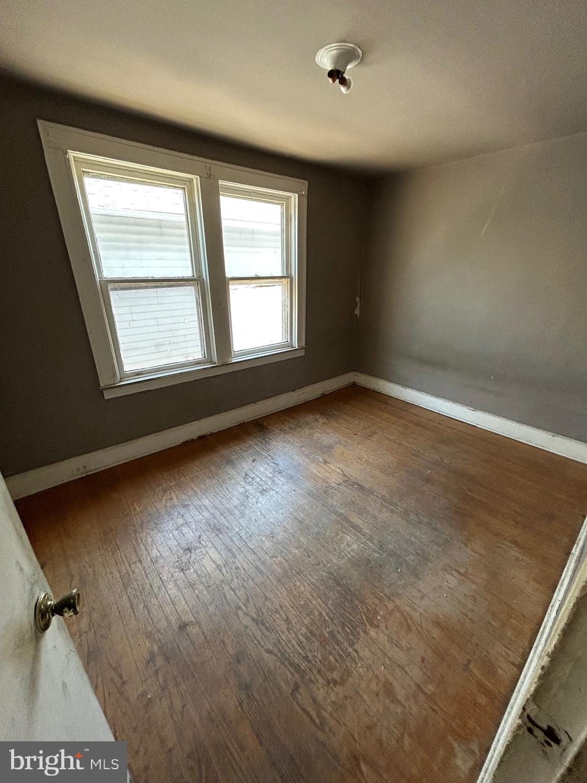 3206 Hayward Avenue Baltimore, MD 21215 - Photo 8 of 12 an empty room with a window