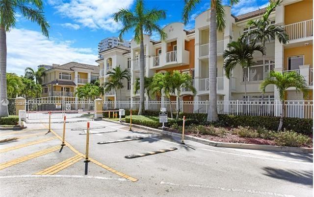 a building exterior with glass door and outdoor space
