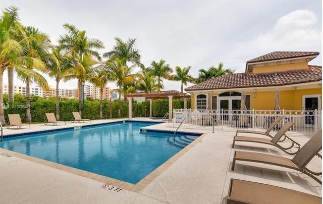 swimming pool with outdoor seating and deck