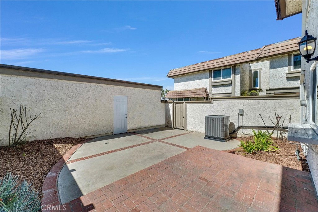 13966 Hammon Place Westminster, CA 92683 - Photo 18 of 45 a backyard of a house with potted plants and large tree