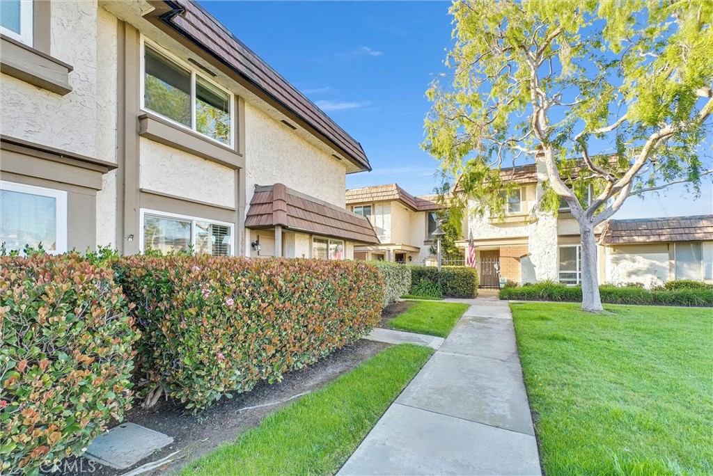 13966 Hammon Place Westminster, CA 92683 - Photo 2 of 45 a front view of a house with a garden