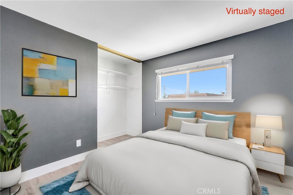 13966 Hammon Place Westminster, CA 92683 - Photo 22 of 45 a bedroom with a bed and a painting on the wall