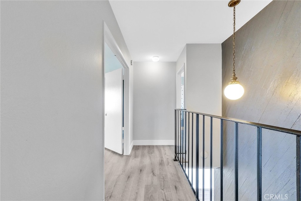 13966 Hammon Place Westminster, CA 92683 - Photo 25 of 45 a view of a hallway with wooden floor