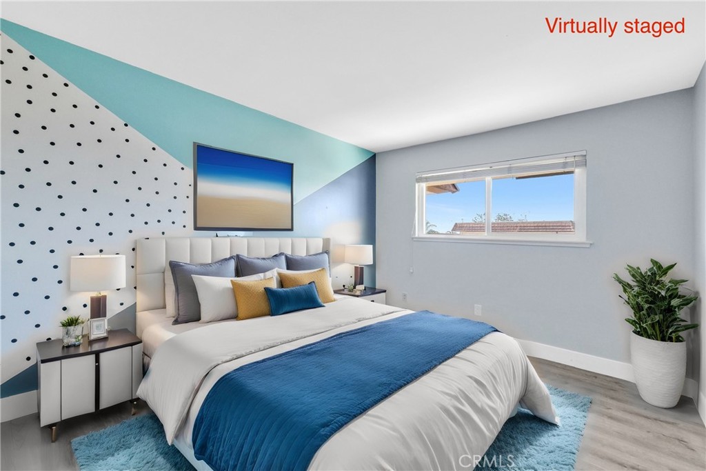 13966 Hammon Place Westminster, CA 92683 - Photo 31 of 45 a bedroom with bed and wooden floor