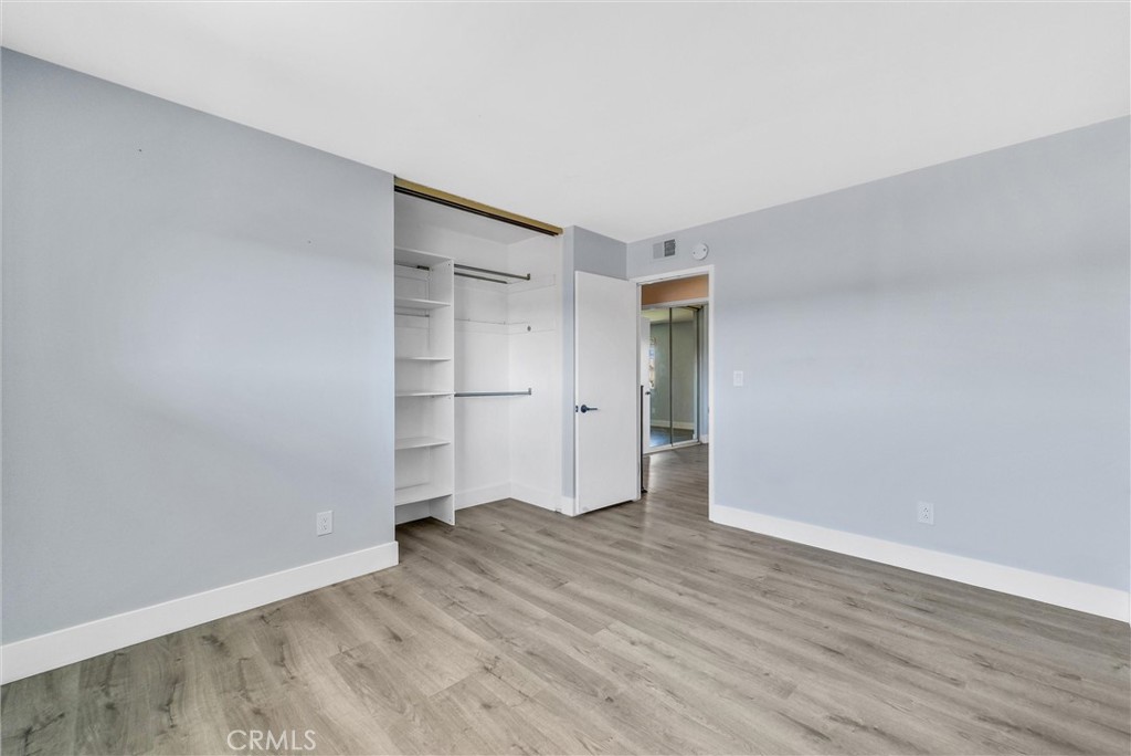 13966 Hammon Place Westminster, CA 92683 - Photo 32 of 45 a view of an empty room with wooden floor and closet
