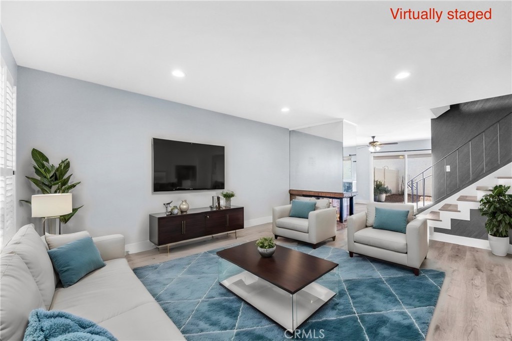 13966 Hammon Place Westminster, CA 92683 - Photo 5 of 45 a living room with furniture and a flat screen tv