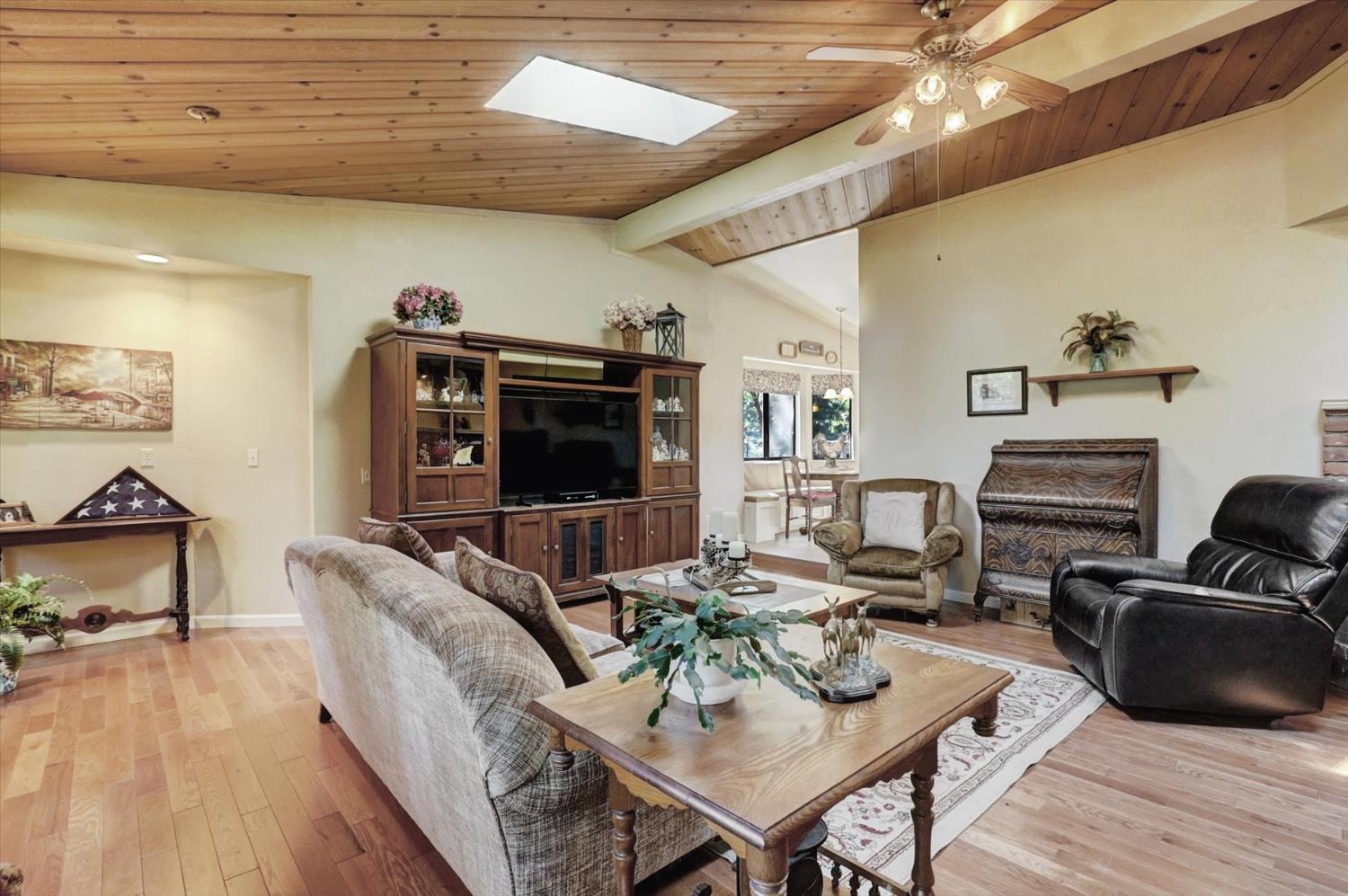 17682 Alexandra Way Grass Valley, CA 95949 - Photo 11 of 55 a living room with furniture a flat screen tv and a table