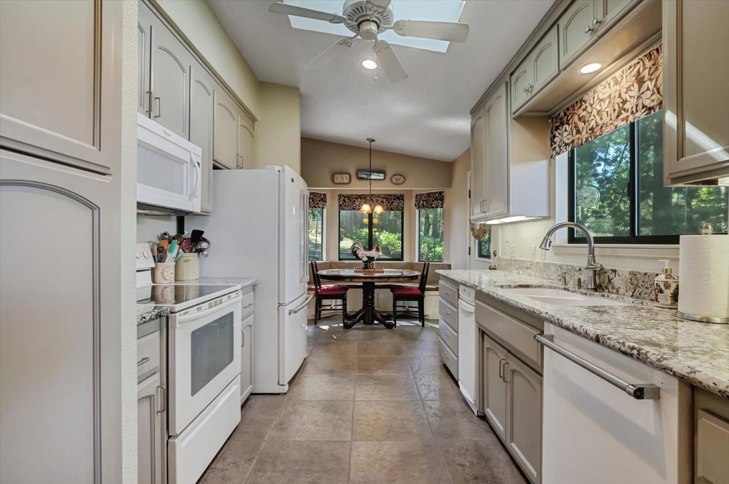 17682 Alexandra Way Grass Valley, CA 95949 - Photo 13 of 55 a kitchen with stainless steel appliances granite countertop lots of counter top space and wooden floor