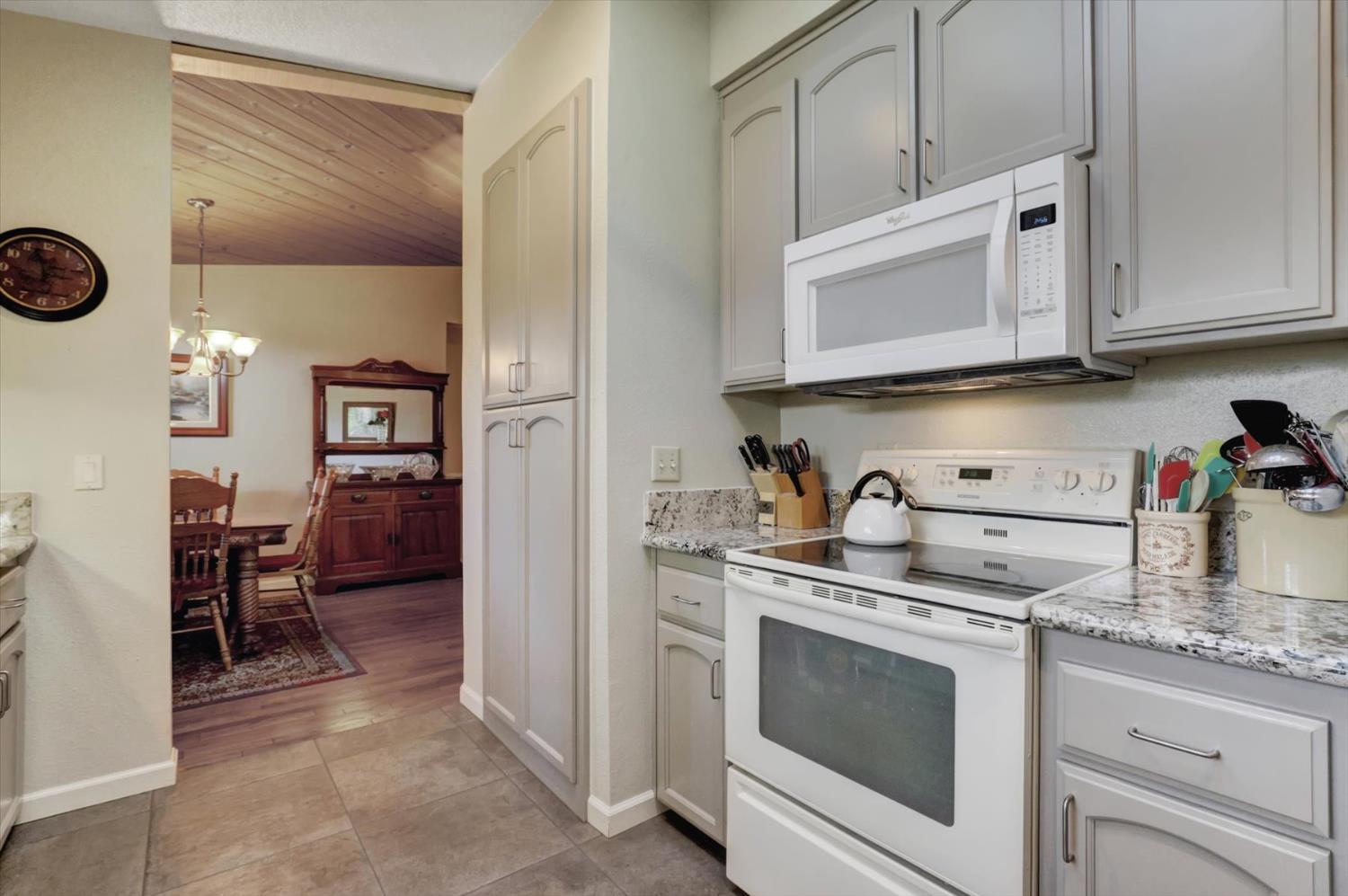 17682 Alexandra Way Grass Valley, CA 95949 - Photo 17 of 55 a kitchen with granite countertop cabinets stainless steel appliances and a counter space
