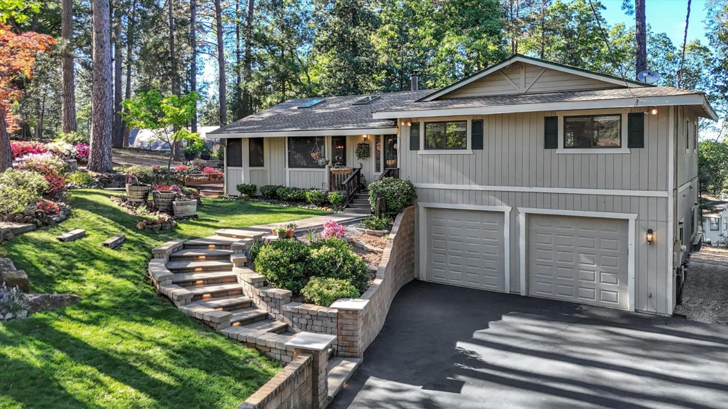 17682 Alexandra Way Grass Valley, CA 95949 - Photo 2 of 55 a front view of a house with a yard