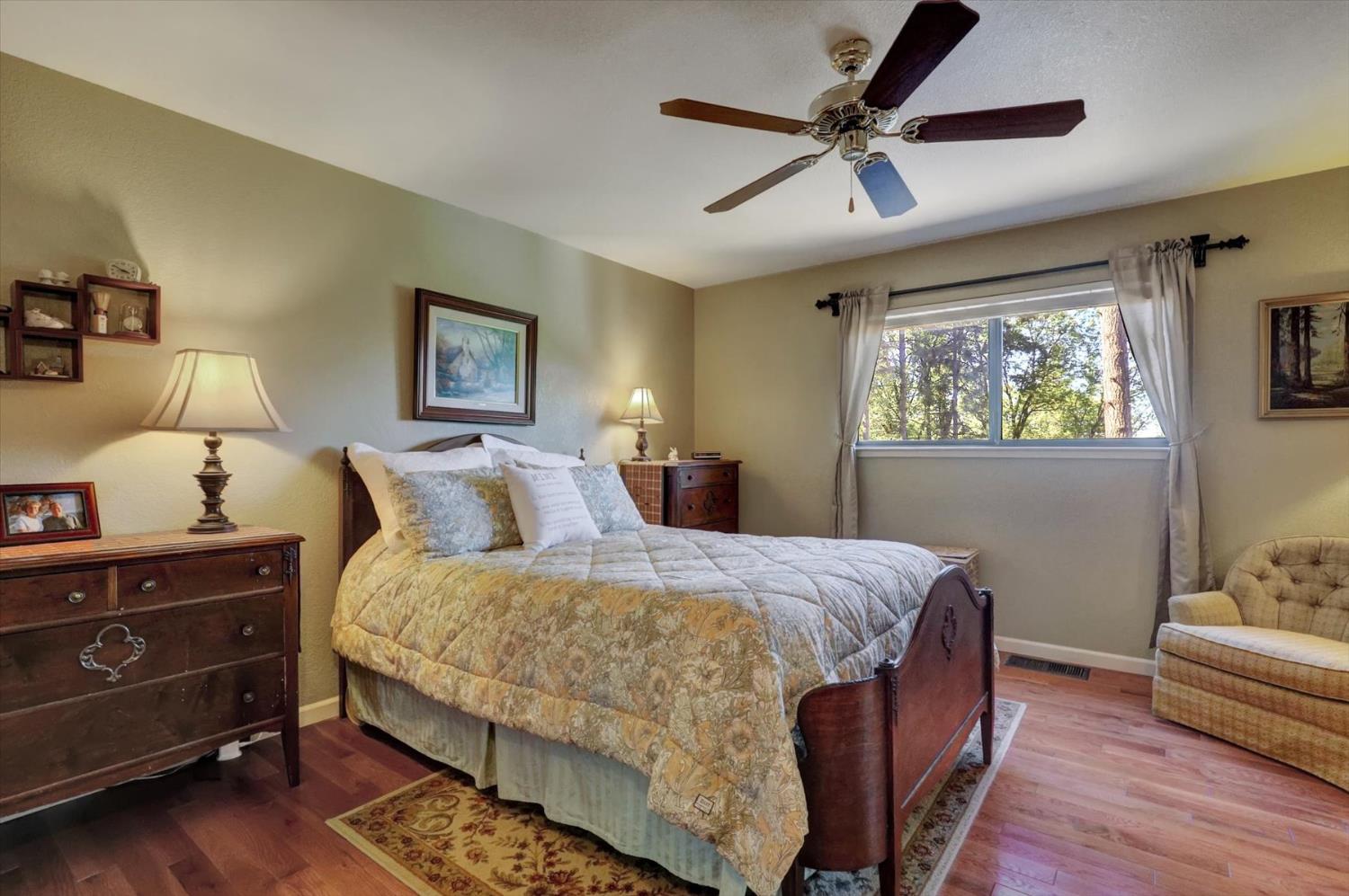 17682 Alexandra Way Grass Valley, CA 95949 - Photo 21 of 55 a bedroom with a bed and window