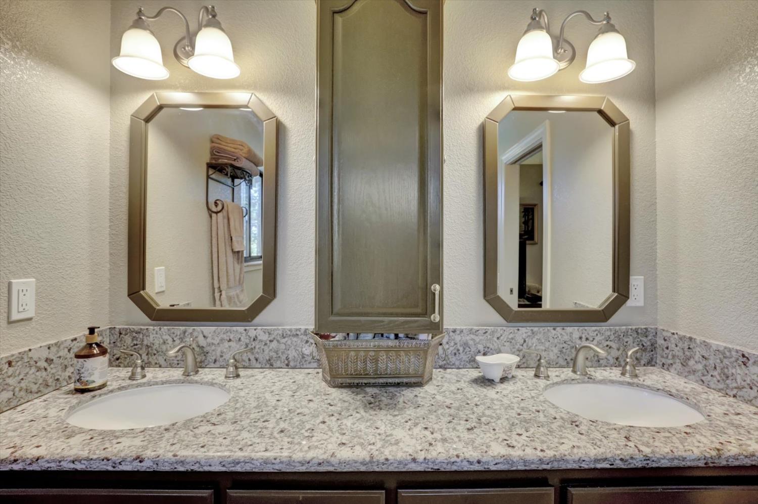 17682 Alexandra Way Grass Valley, CA 95949 - Photo 24 of 55 a bathroom with double vanity sinks and a mirror