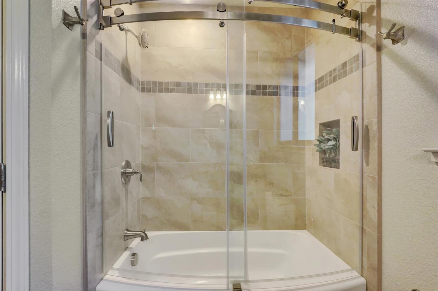 17682 Alexandra Way Grass Valley, CA 95949 - Photo 30 of 55 a bathroom with a shower and a bath tub