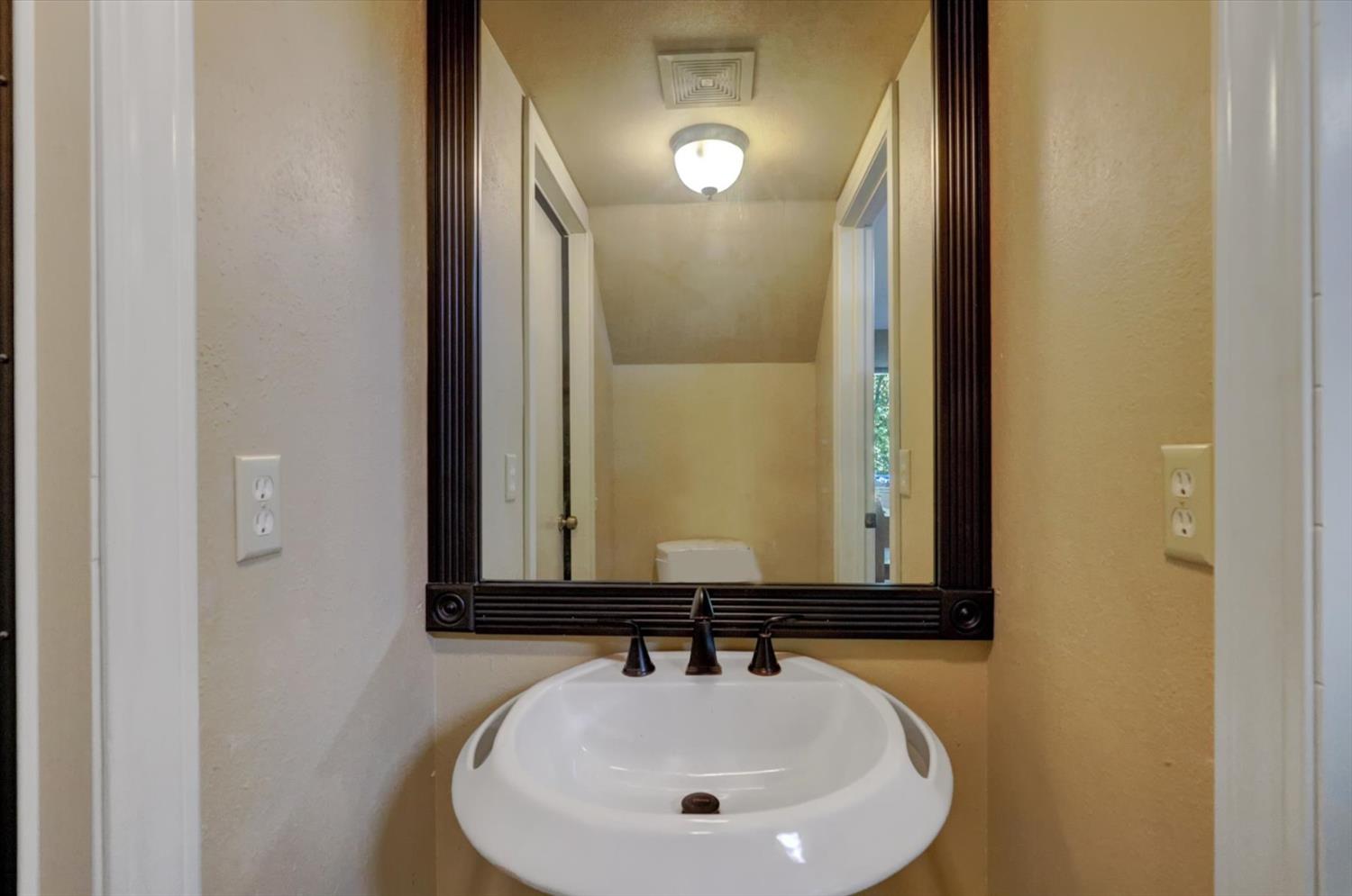 17682 Alexandra Way Grass Valley, CA 95949 - Photo 35 of 55 a bathroom with a sink and a mirror