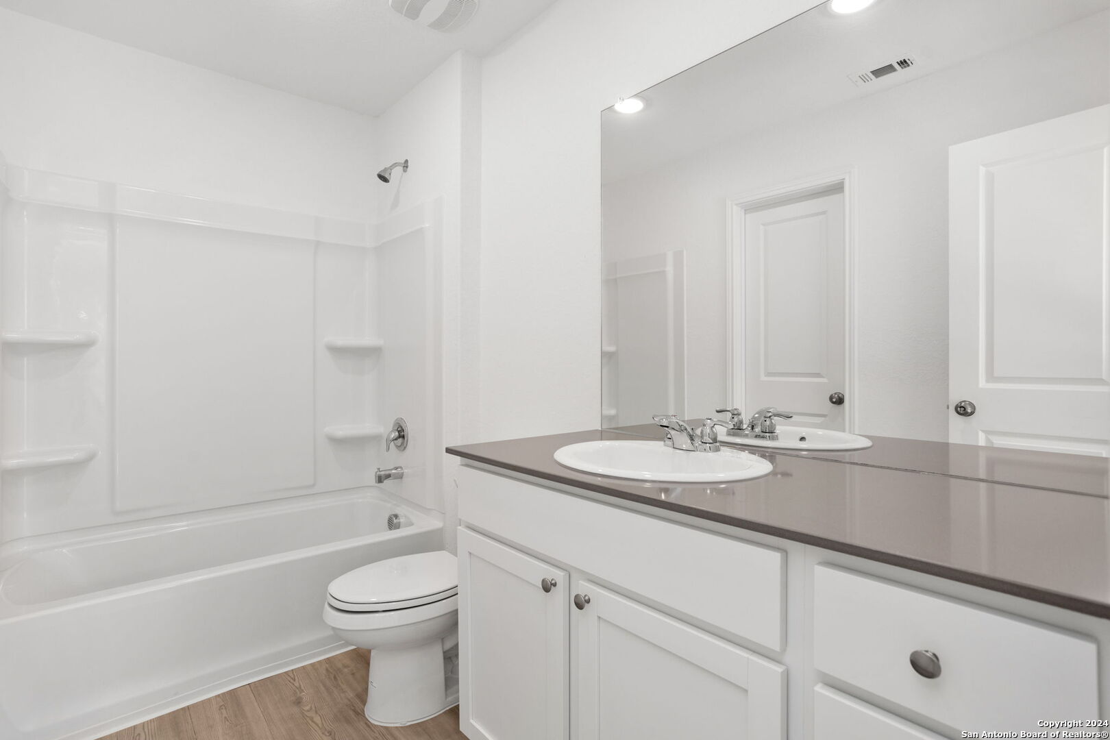 942 Landon Ridge San Antonio, TX 78253 - Photo 19 of 38 a bathroom with a sink a toilet and shower