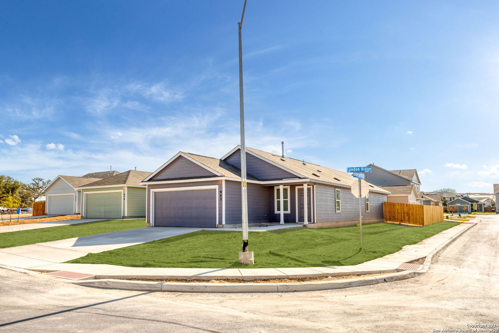 942 Landon Ridge San Antonio, TX 78253 - Photo 3 of 38 a front view of a house with a garden