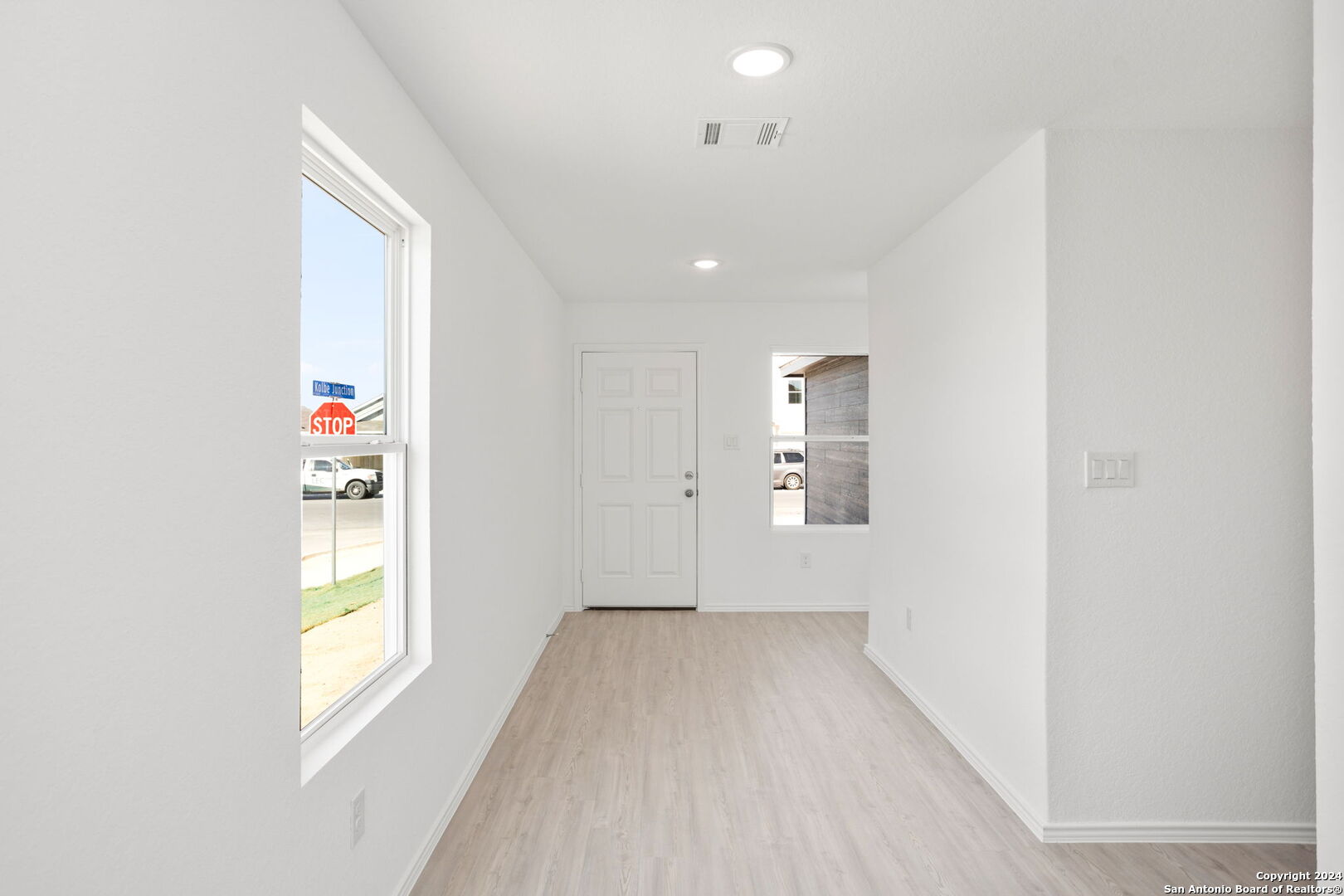 942 Landon Ridge San Antonio, TX 78253 - Photo 5 of 38 a view of hallway with window and wooden floor