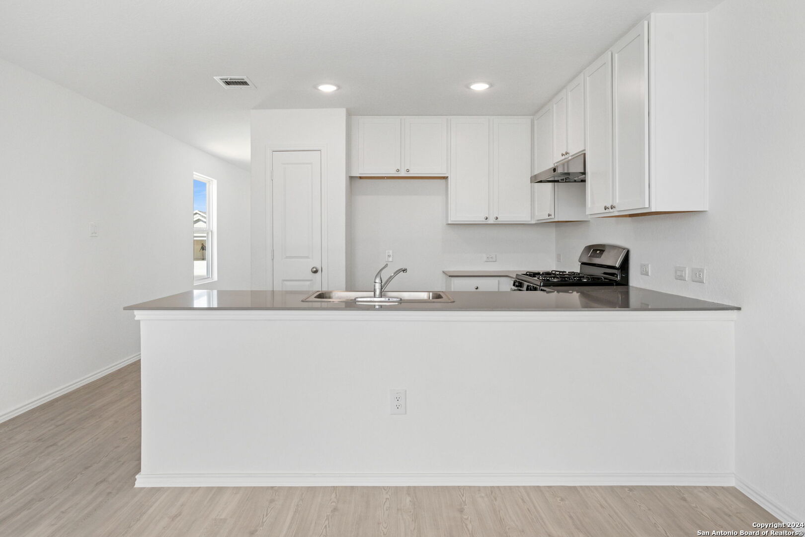 942 Landon Ridge San Antonio, TX 78253 - Photo 9 of 38 a kitchen with kitchen island sink stove and cabinets