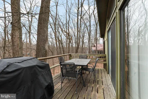 a view of a balcony with two chairs