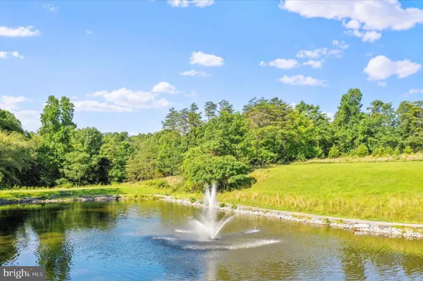 an outdoor space with swimming pool and furniture