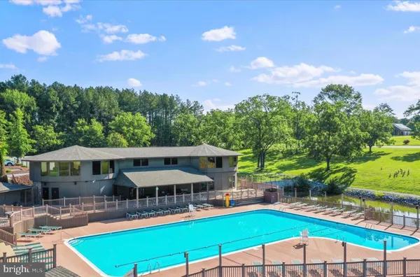 a view of a swimming pool with a chairs
