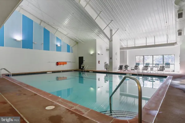 a view of a hallway with paintings on the wall