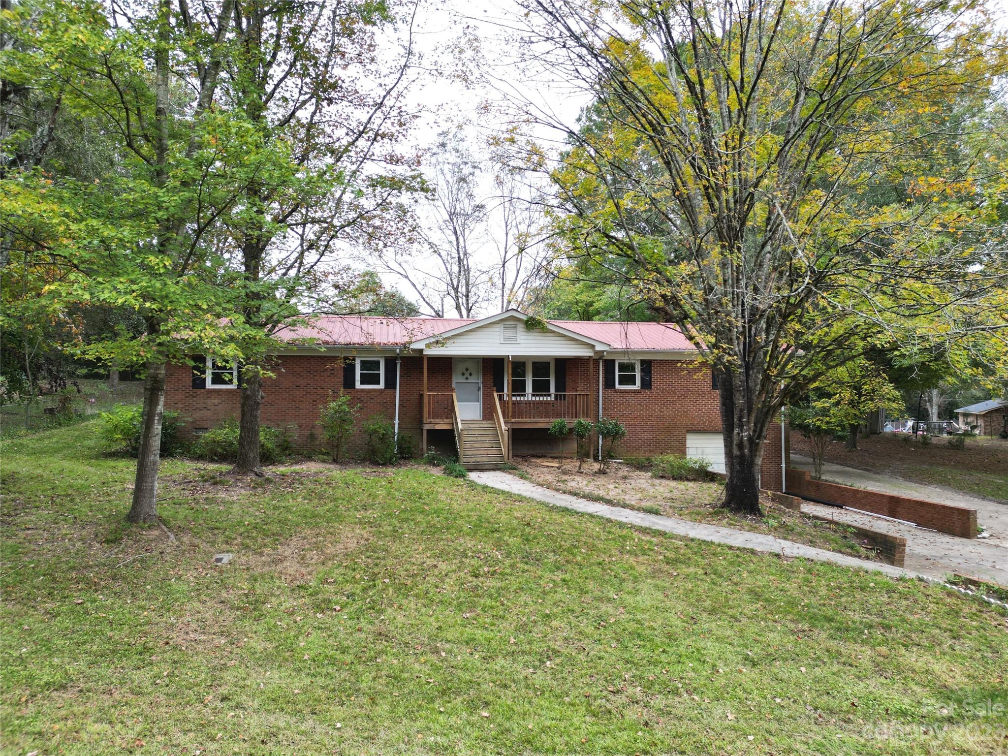 a house with trees in the background