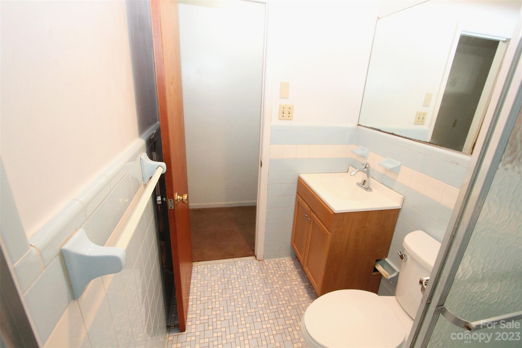 144 Allen Pond Road Wadesboro, NC 28170 - Photo 19 of 40 a bathroom with a sink toilet and mirror