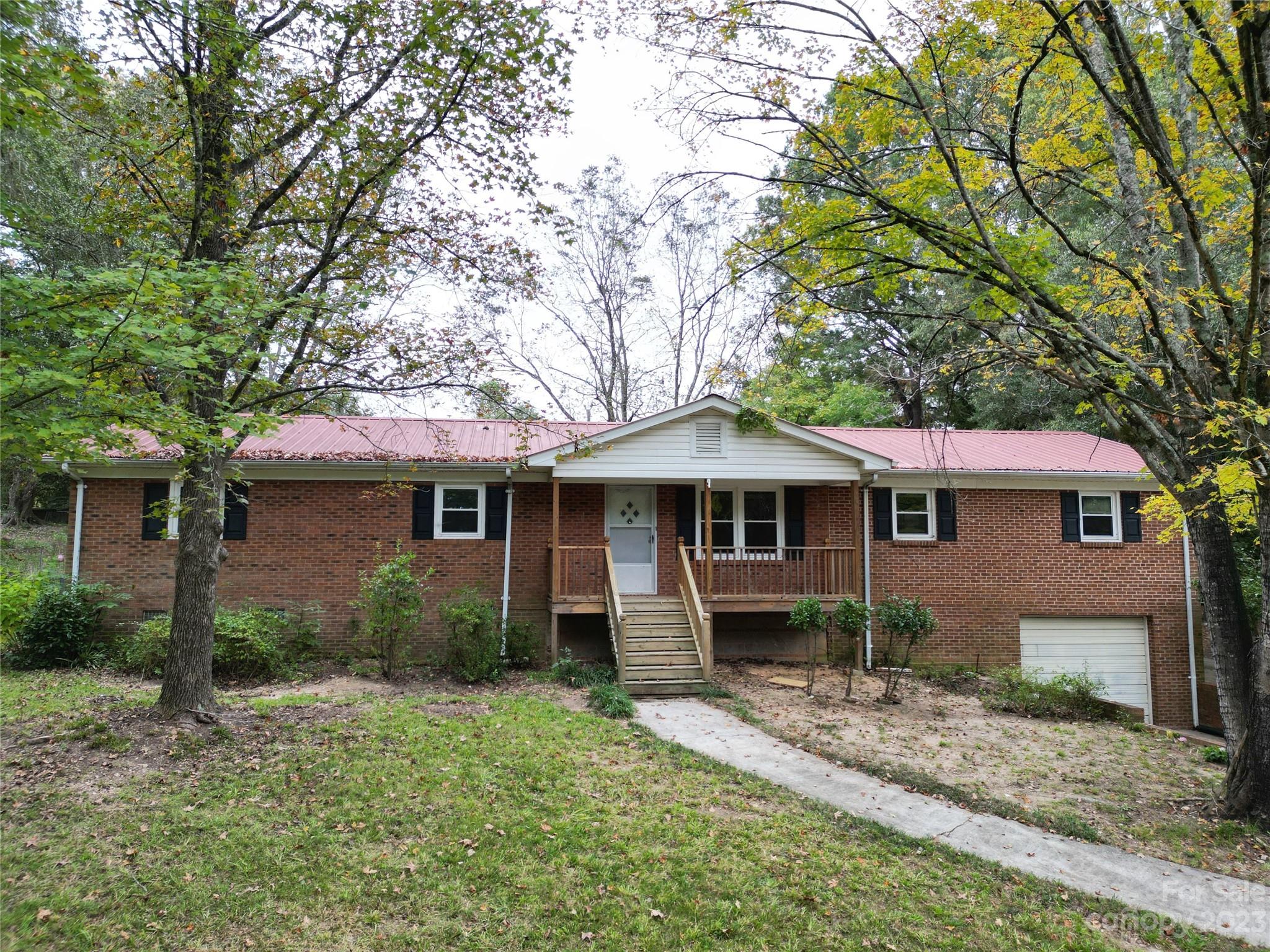 144 Allen Pond Road Wadesboro, NC 28170 - Photo 2 of 40 a front view of a house with garden