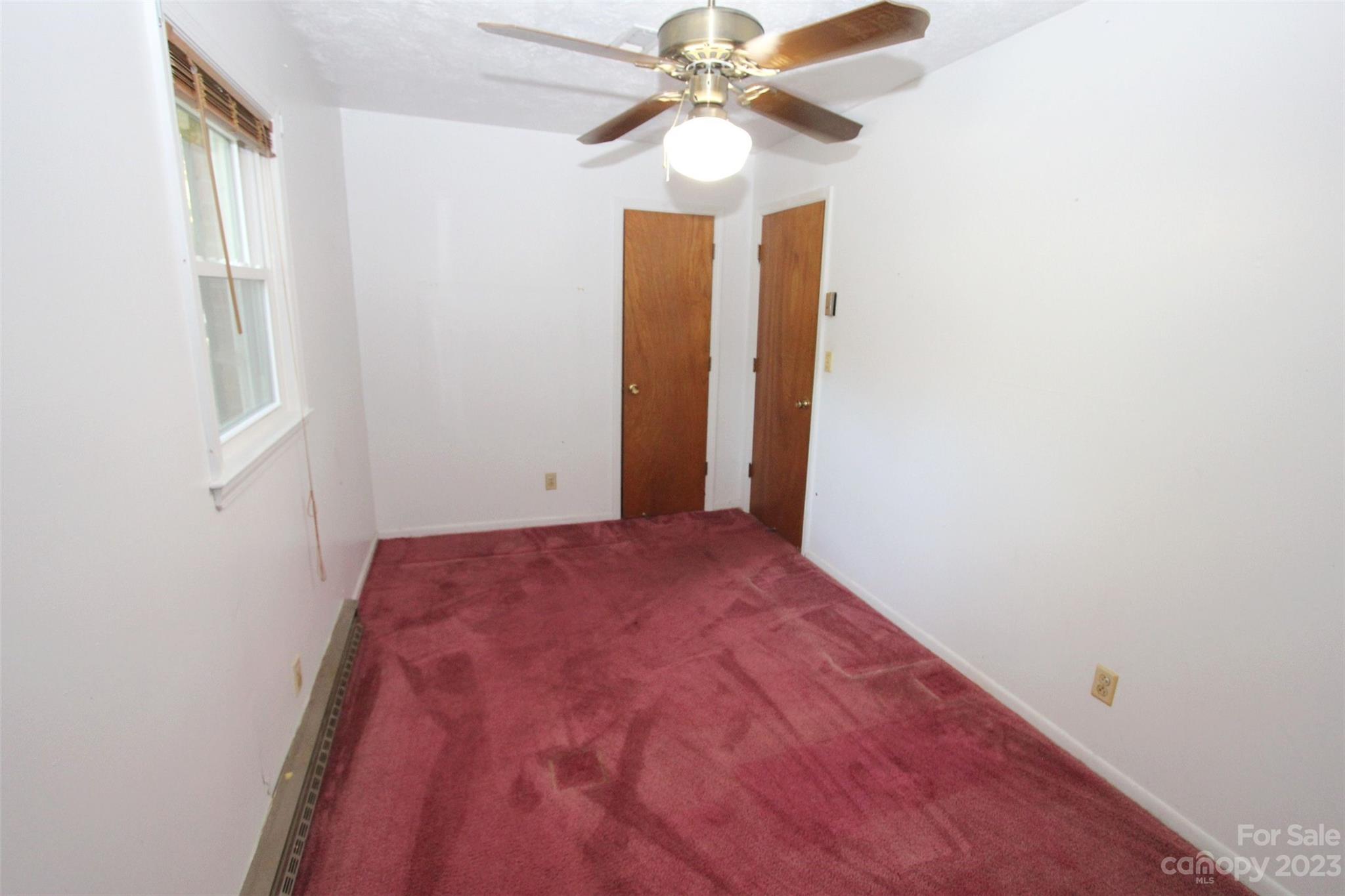 144 Allen Pond Road Wadesboro, NC 28170 - Photo 21 of 40 a view of a hallway with closet and a chandelier fan