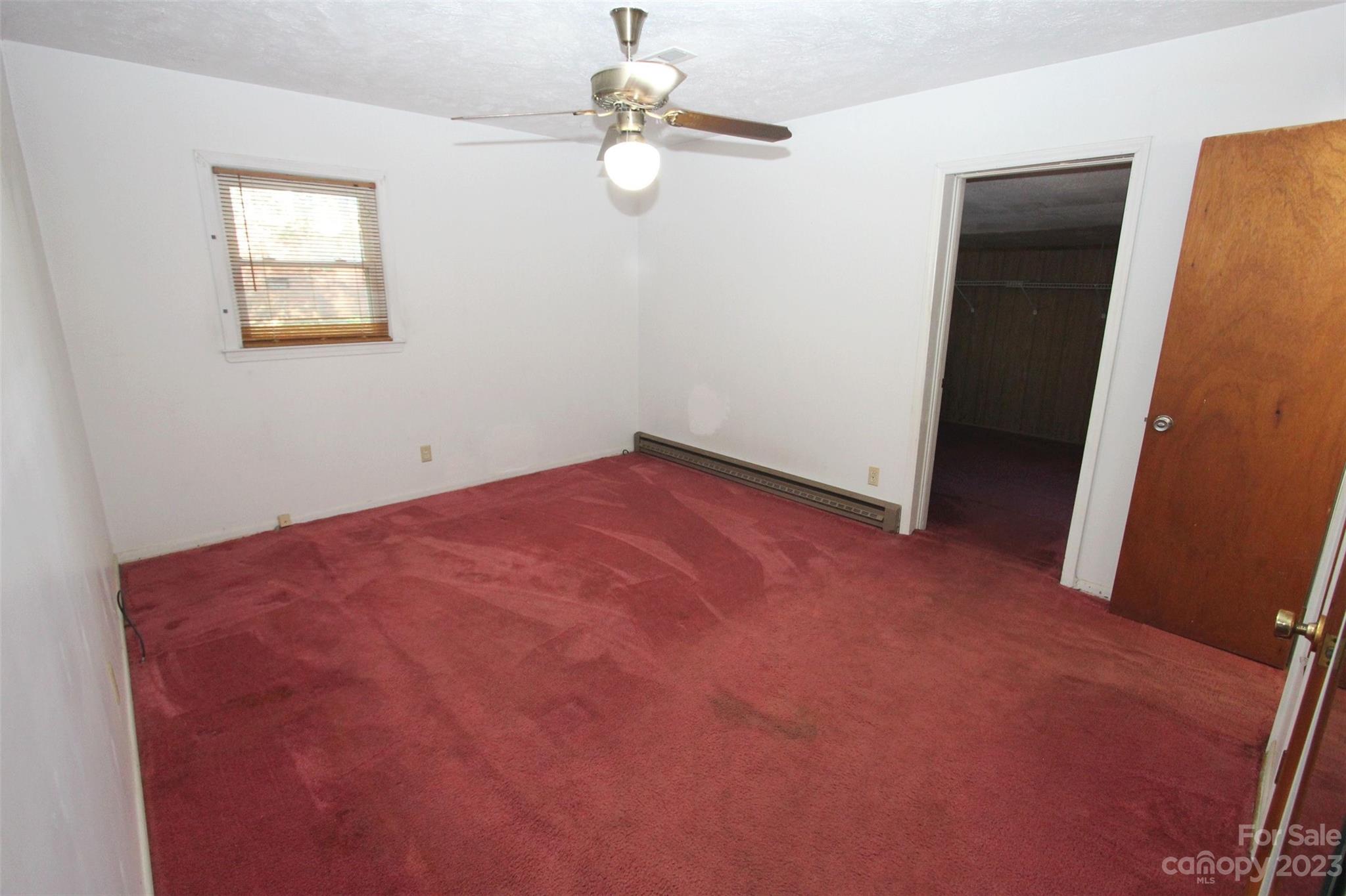 144 Allen Pond Road Wadesboro, NC 28170 - Photo 24 of 40 an empty room with windows and fan
