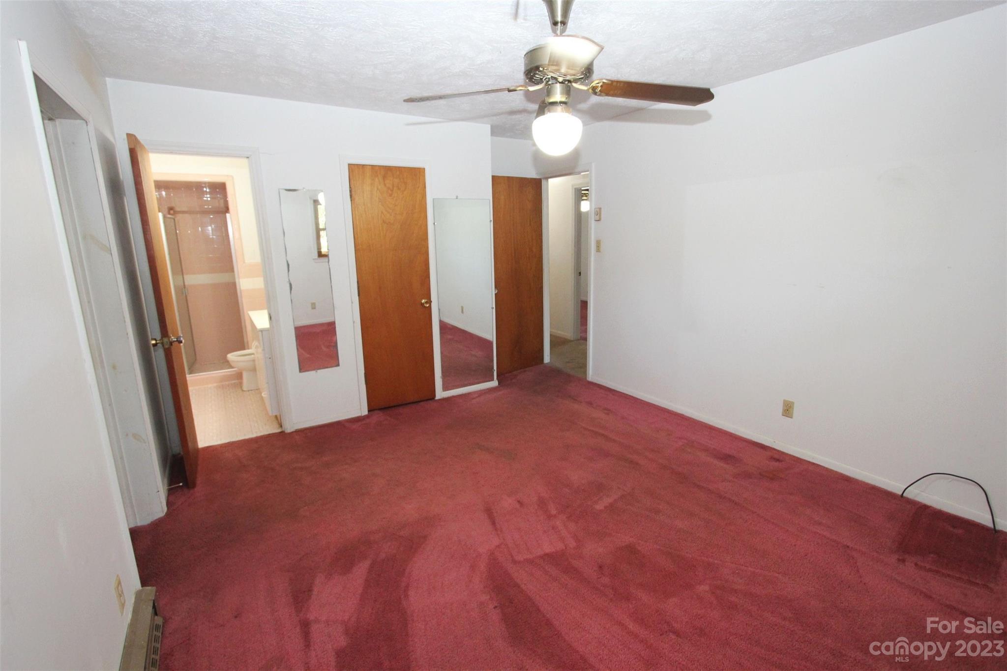144 Allen Pond Road Wadesboro, NC 28170 - Photo 25 of 40 a view of a room with a hanging light and hardwood floor