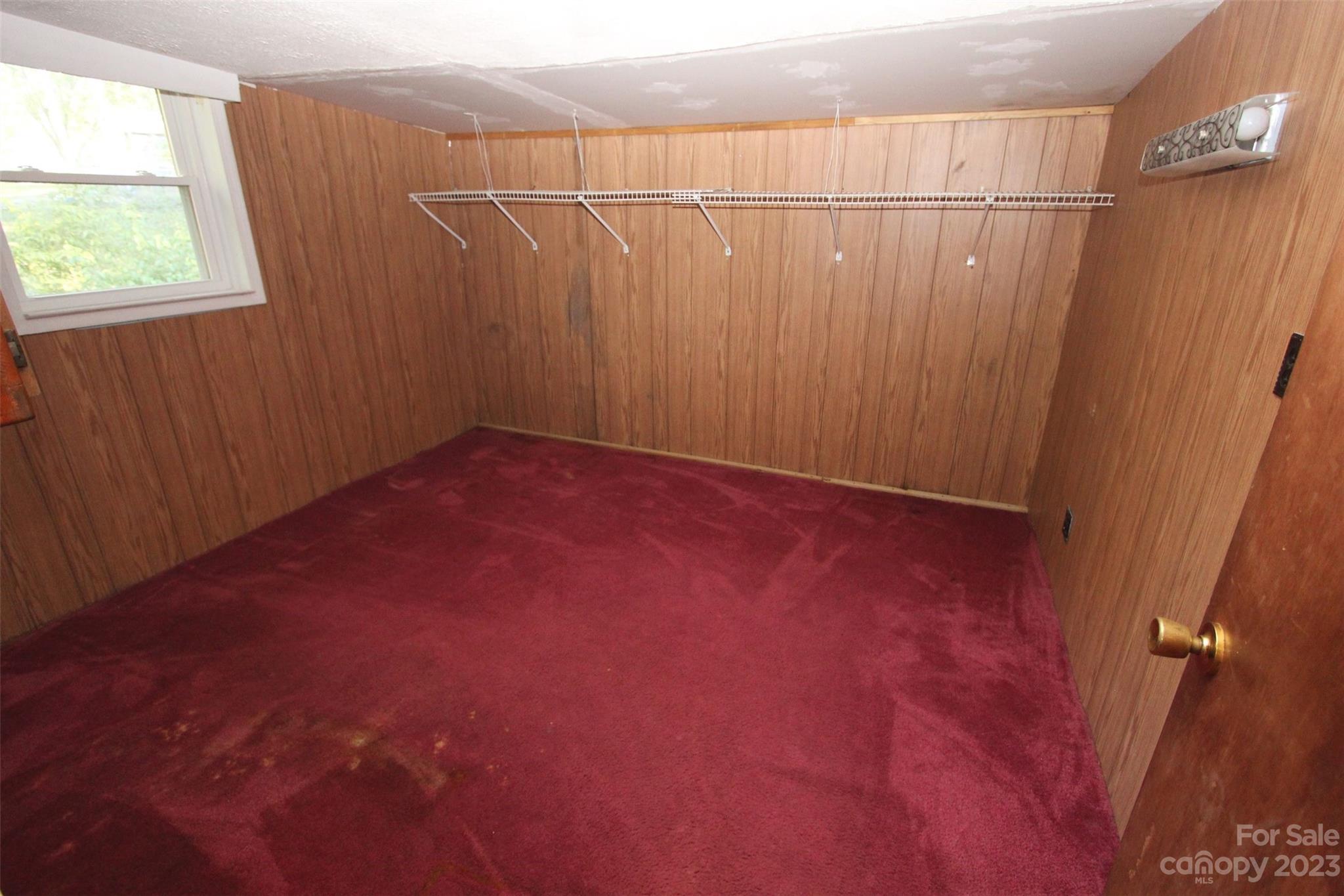 144 Allen Pond Road Wadesboro, NC 28170 - Photo 28 of 40 en empty room with a wooden floor and a window