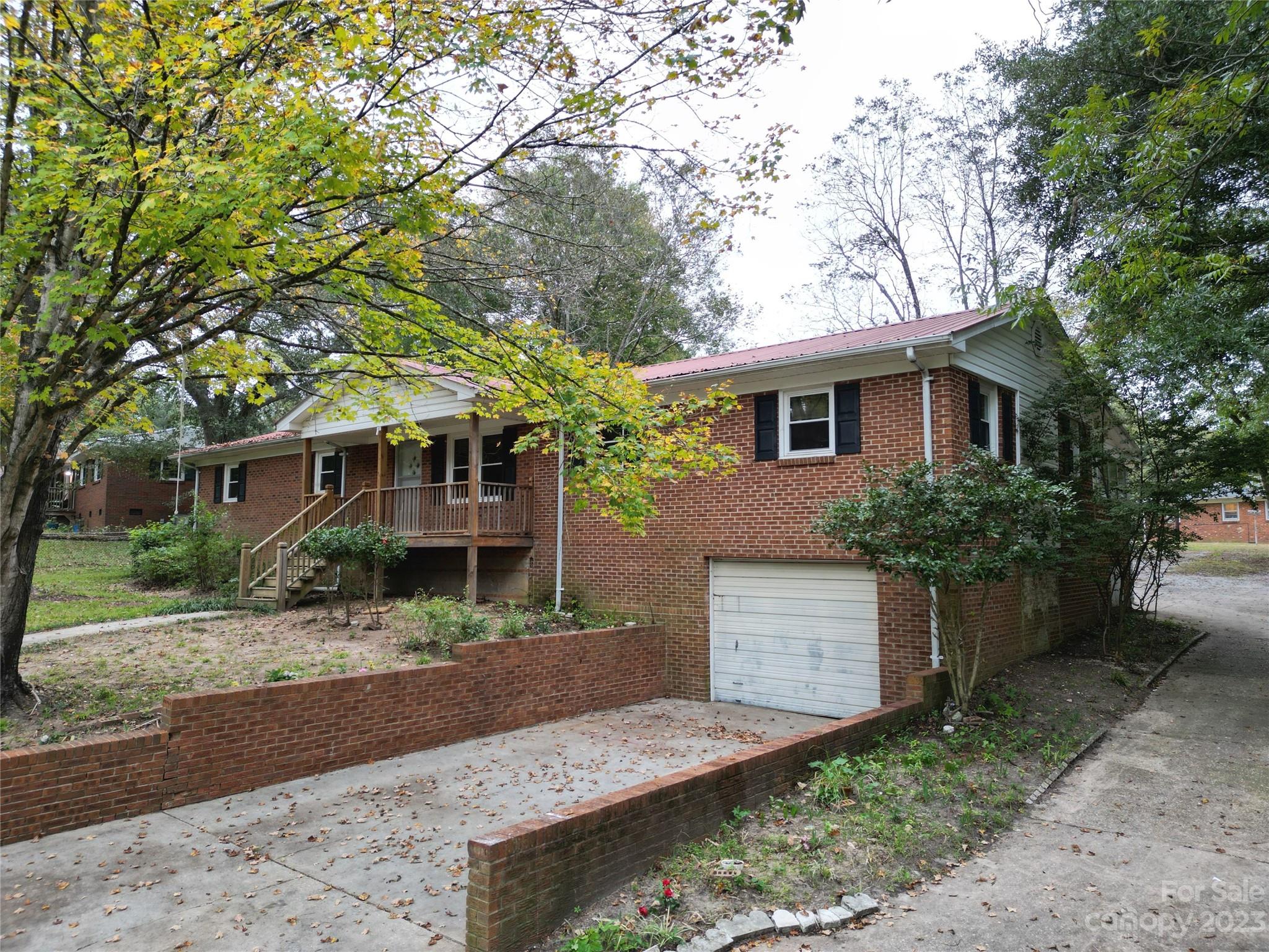 144 Allen Pond Road Wadesboro, NC 28170 - Photo 3 of 40 a front view of a house with a yard garage and outdoor seating