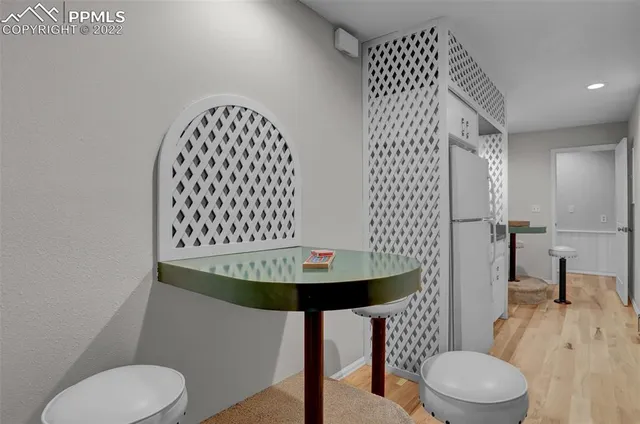 a bathroom with a sink toilet and a mirror