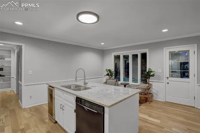 a kitchen with a sink and cabinets