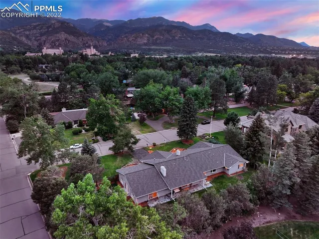 an aerial view of a house with mountain view