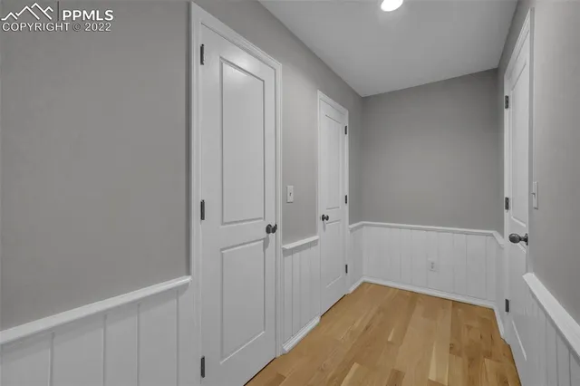 a view of a room with wooden floor