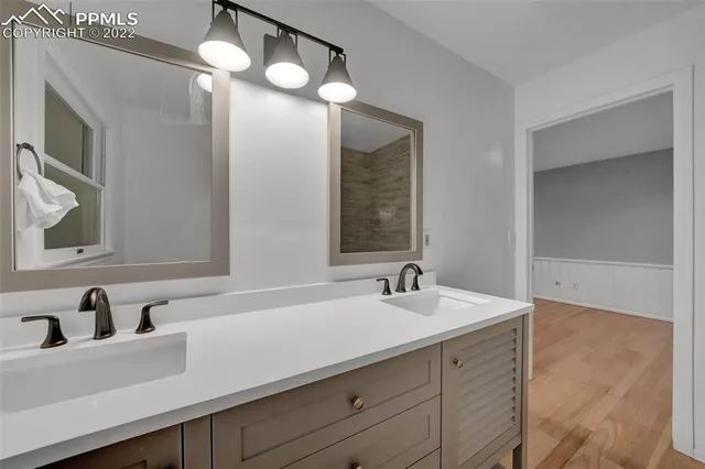 a bathroom with a sink and a mirror