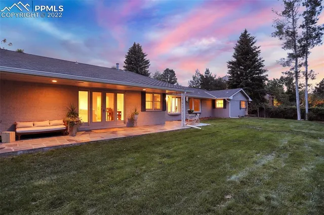 a view of spacious bedroom with a house and garden