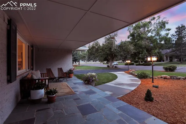 a view of a backyard with sitting area