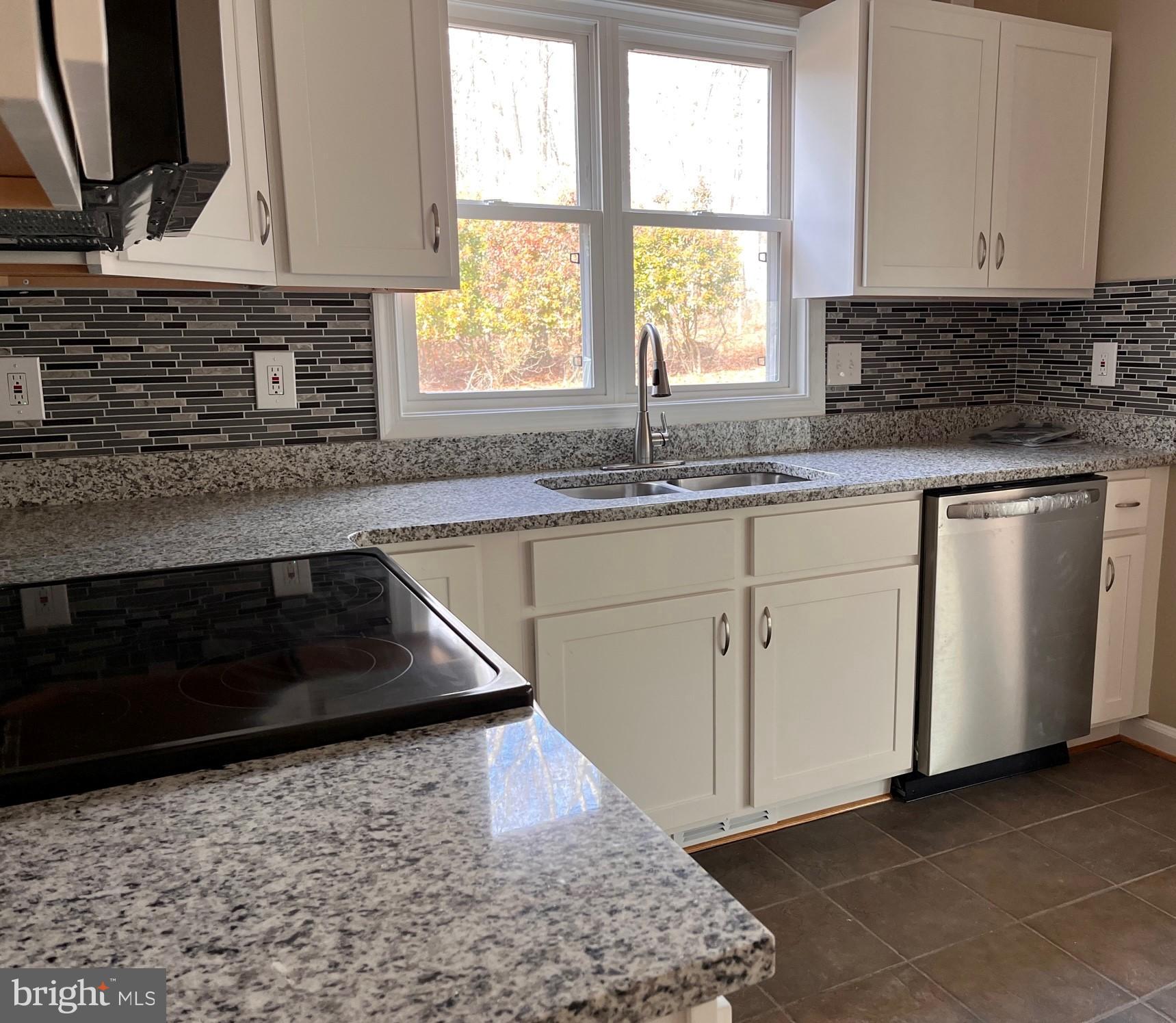 1012 Hillpine Road Middle River, MD 21220 - Photo 7 of 35 a kitchen with granite countertop a sink and a stove