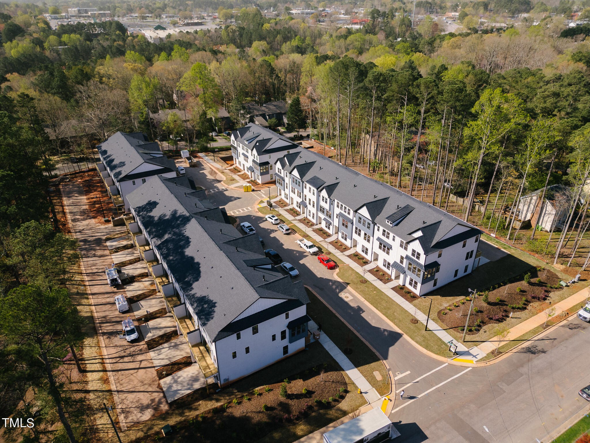 6421 Tanner Oak Lane Raleigh, NC 27613 - Photo 21 of 36 an aerial view of multiple houses with yard
