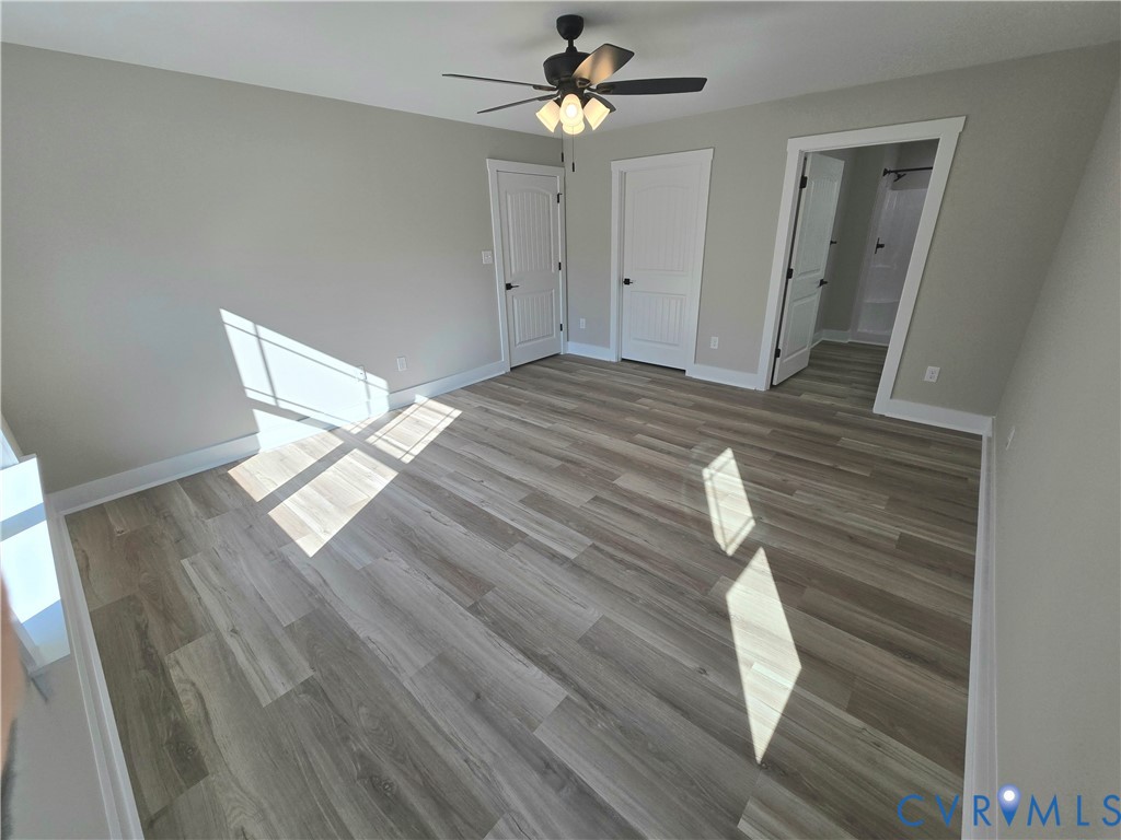1781 Bumpass Road Bumpass, VA 23024 - Photo 23 of 26 a bedroom with a bed and a chandelier