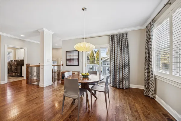 a view of a dining room with furniture and wooden floor