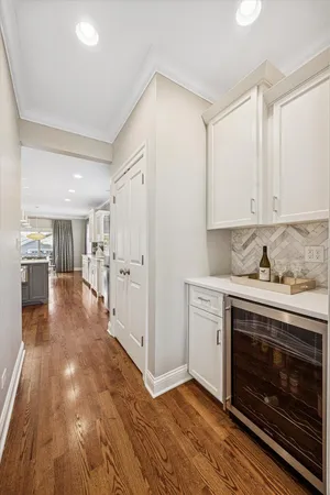 a kitchen with granite countertop a stove and a refrigerator